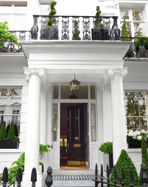 the front entryway of a lavish london home